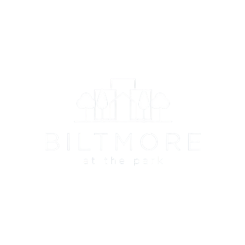 A black and white image of a park with the words "Biltmore at the park" written below it.